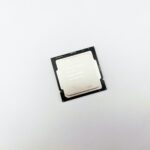 a cpu chip sitting on top of a white surface