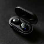 silver and black scissors on black surface