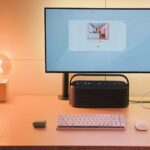 A desk with a laptop and a monitor on it